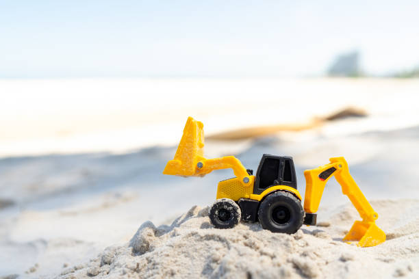 Grävmaskin på stranden